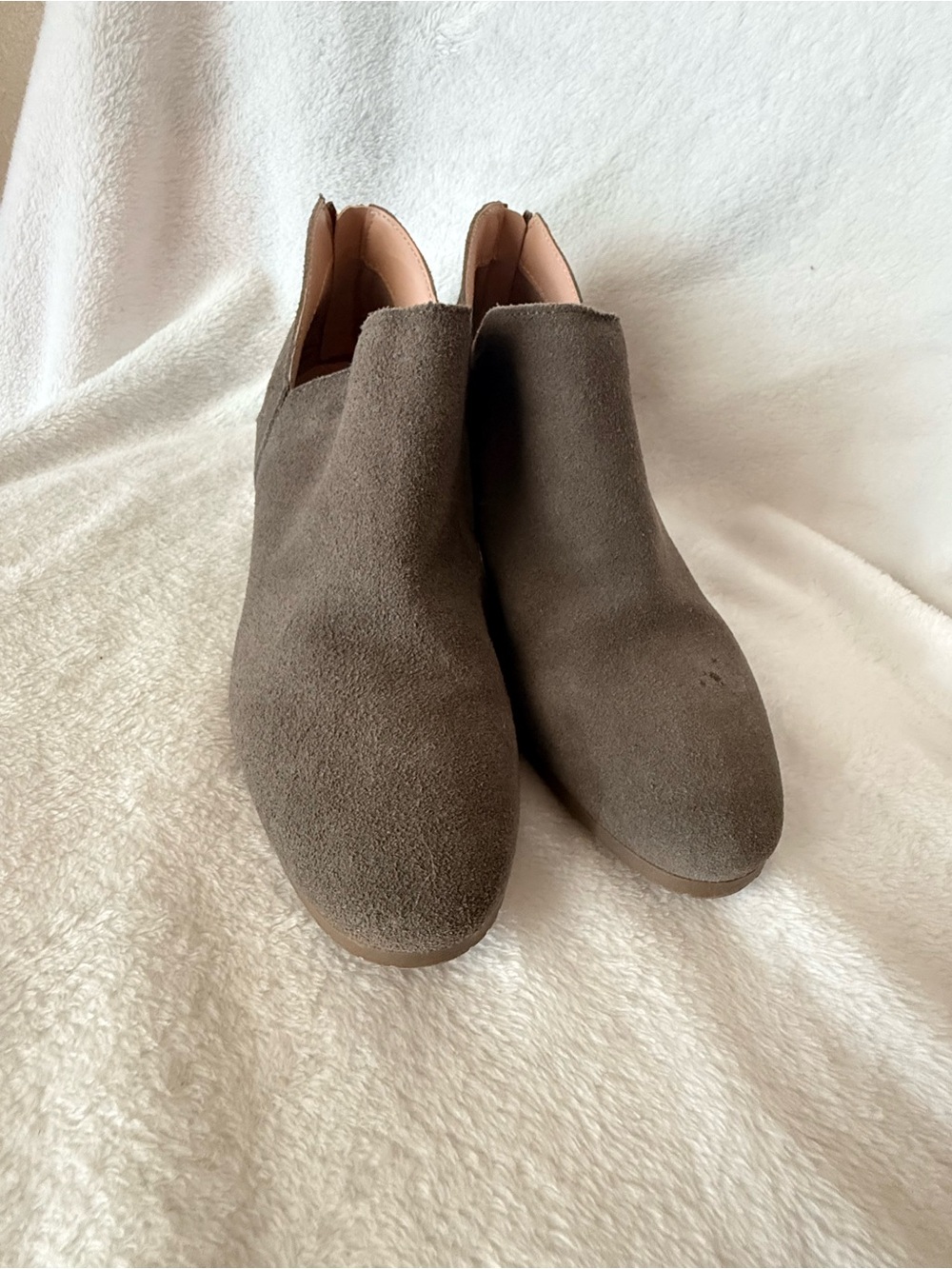 Reaction by Kenneth Cole ankle booties in a versatile taupe/gray color.
